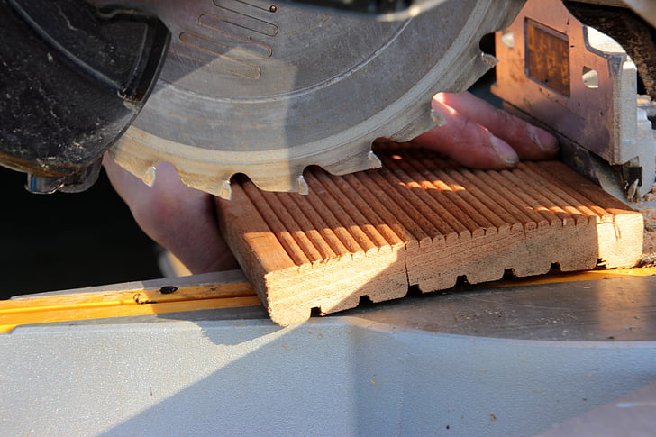 A close-up shot of a circular saw cutting wood How To Cut a Straight Line With a Circular Saw featured photo