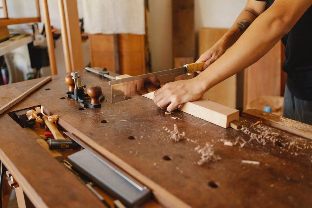 Man using a japanese saws while working