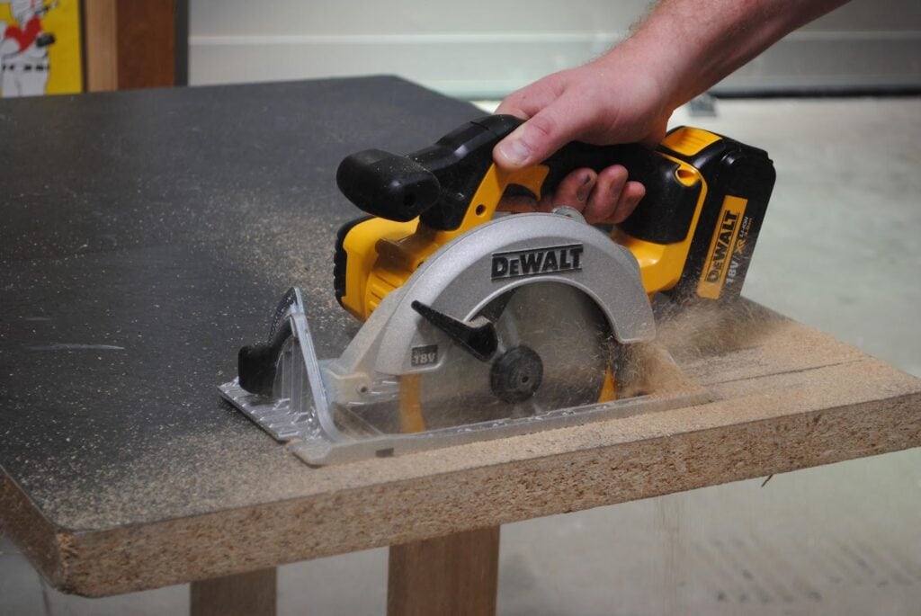 A DeWalt circular saw cutting straight lines on a wood What Is a Circular Saw